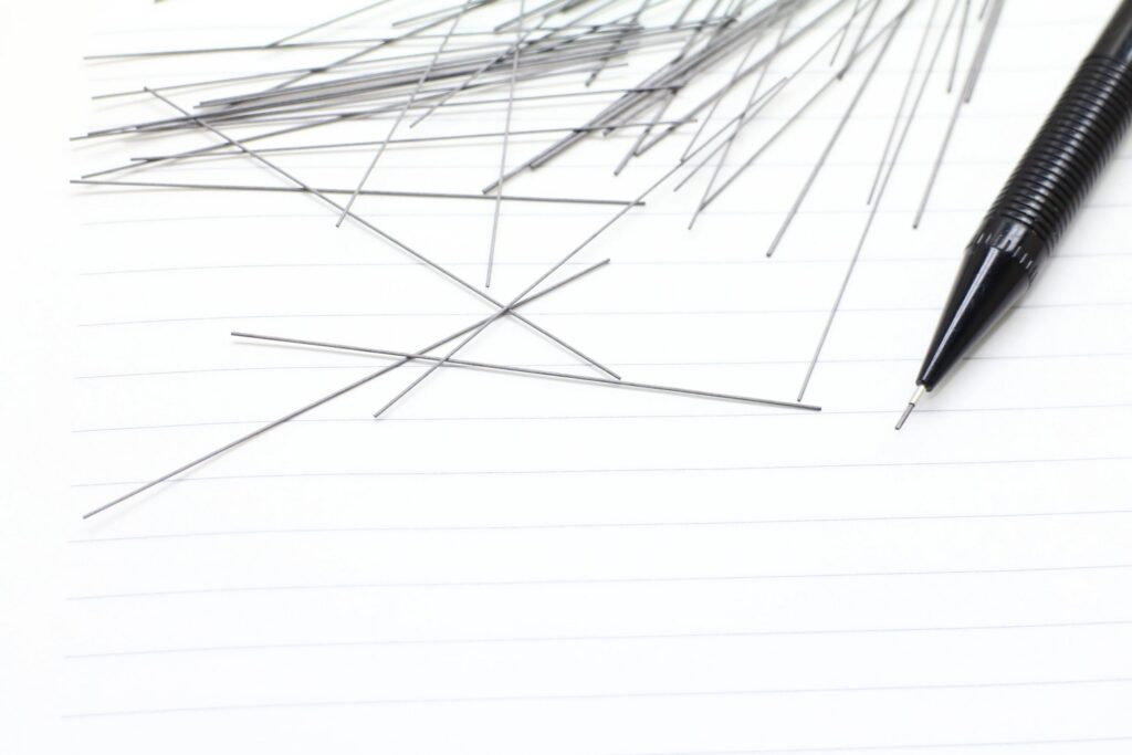 Notebooks, mechanical pencils and scattered cores