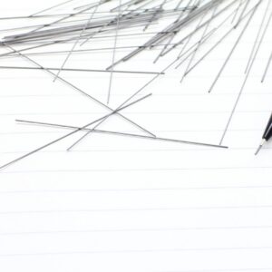 Notebooks, mechanical pencils and scattered cores