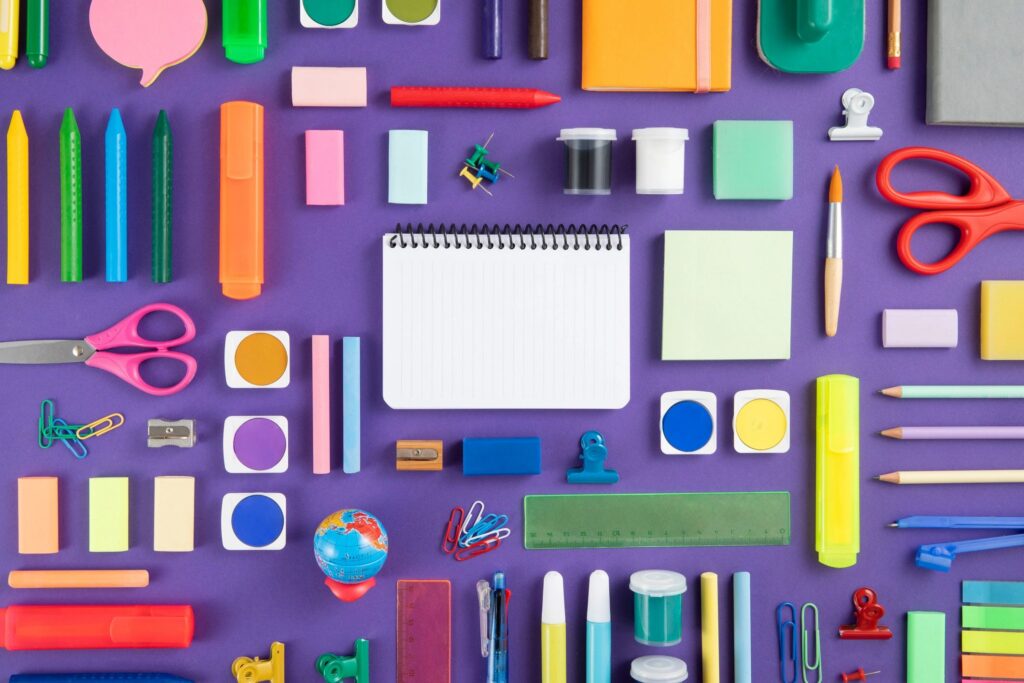 School Supplies on Purple Background