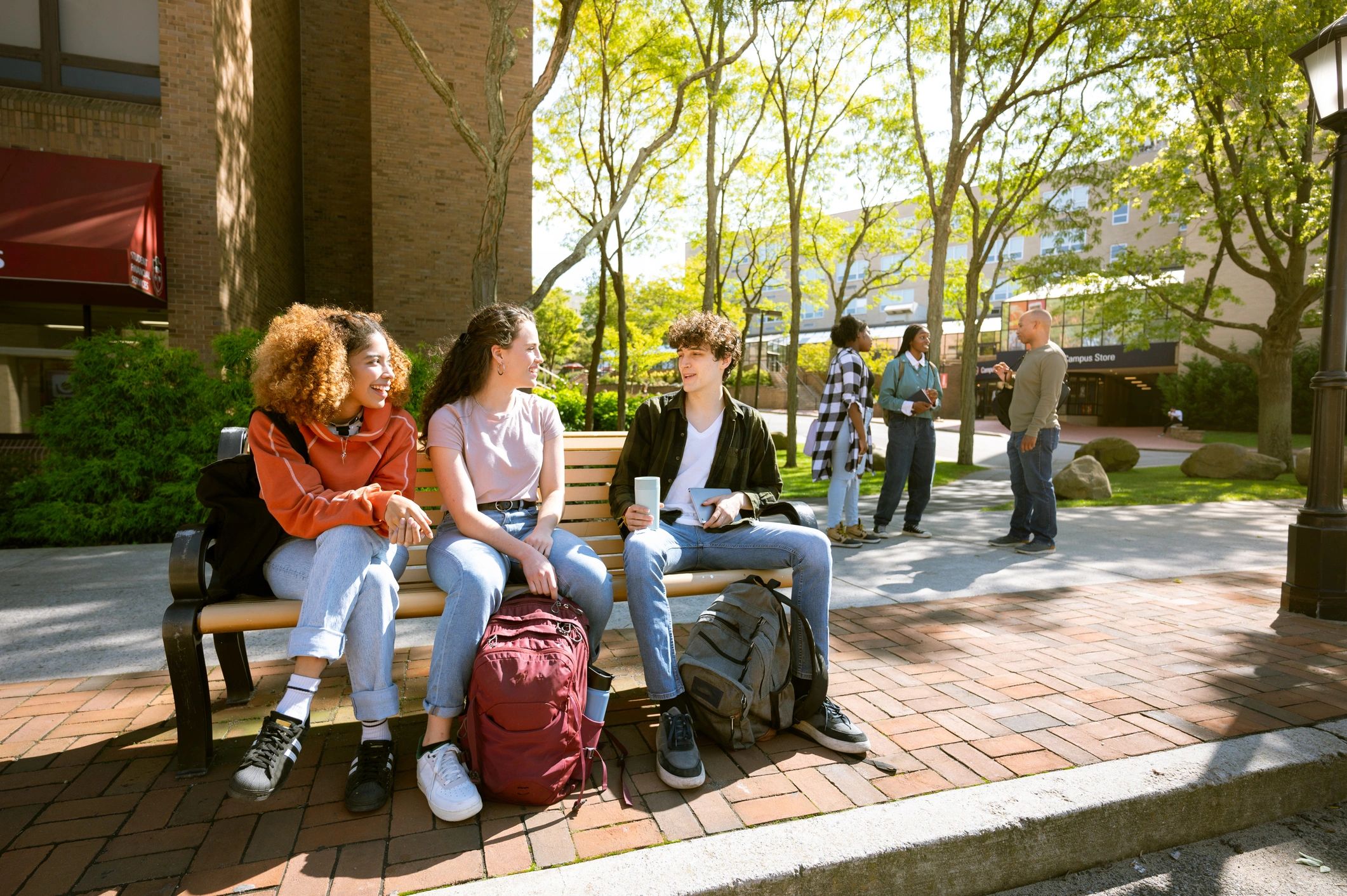 College students on campus with backpacks and supplies