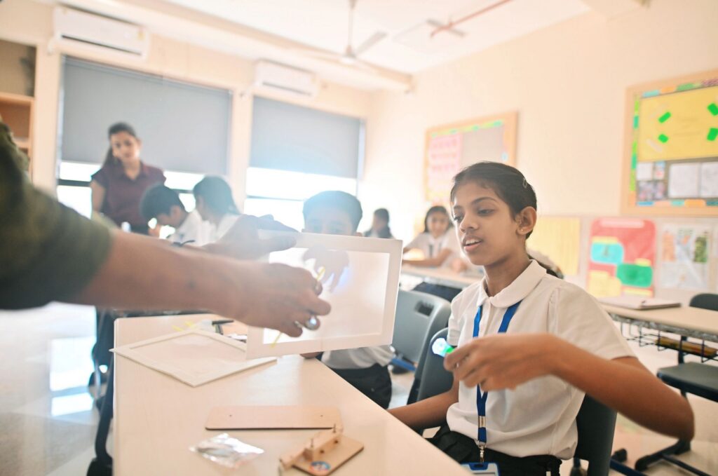 Teacher demonstrating light-up STEM project to students