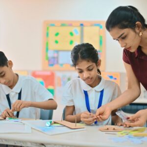 Teacher guiding students in STEM classroom activity